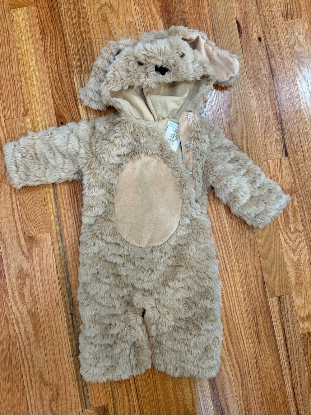 Pottery Barn Kids beige/tan baby bottoms label visible